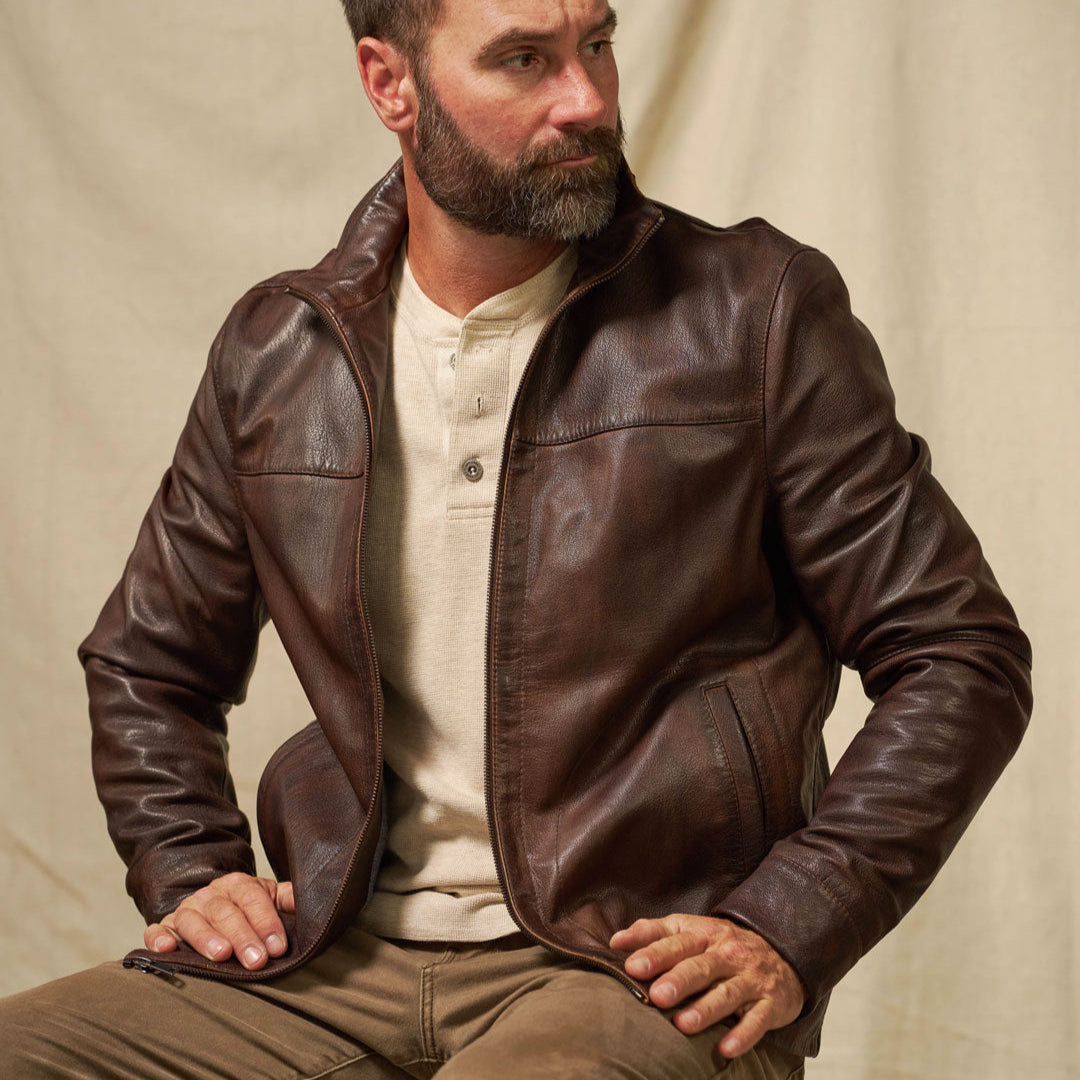 Sedona Lightweight Leather Jacket in Ironwood Brown — worn open over a cream henley, showcasing the clean silhouette and vintage sheepskin leather